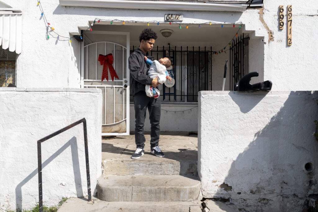 Young man with Infant, Slauson Ave, 2026